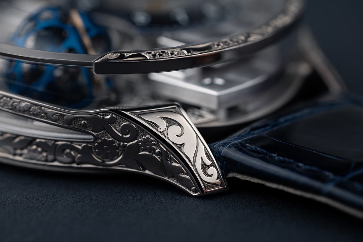 Carved white gold case detail