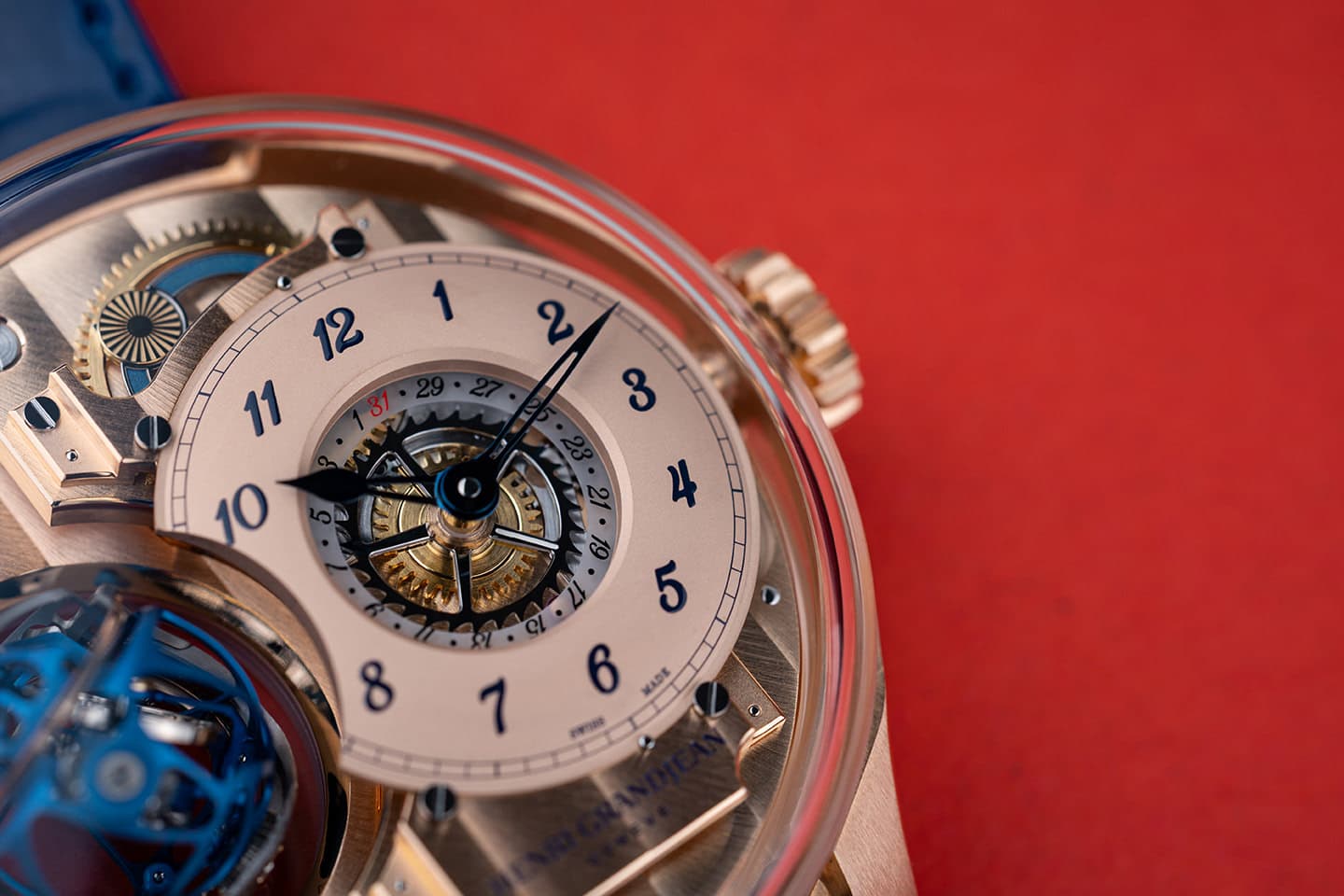 Rose gold dial with blue hour indexes