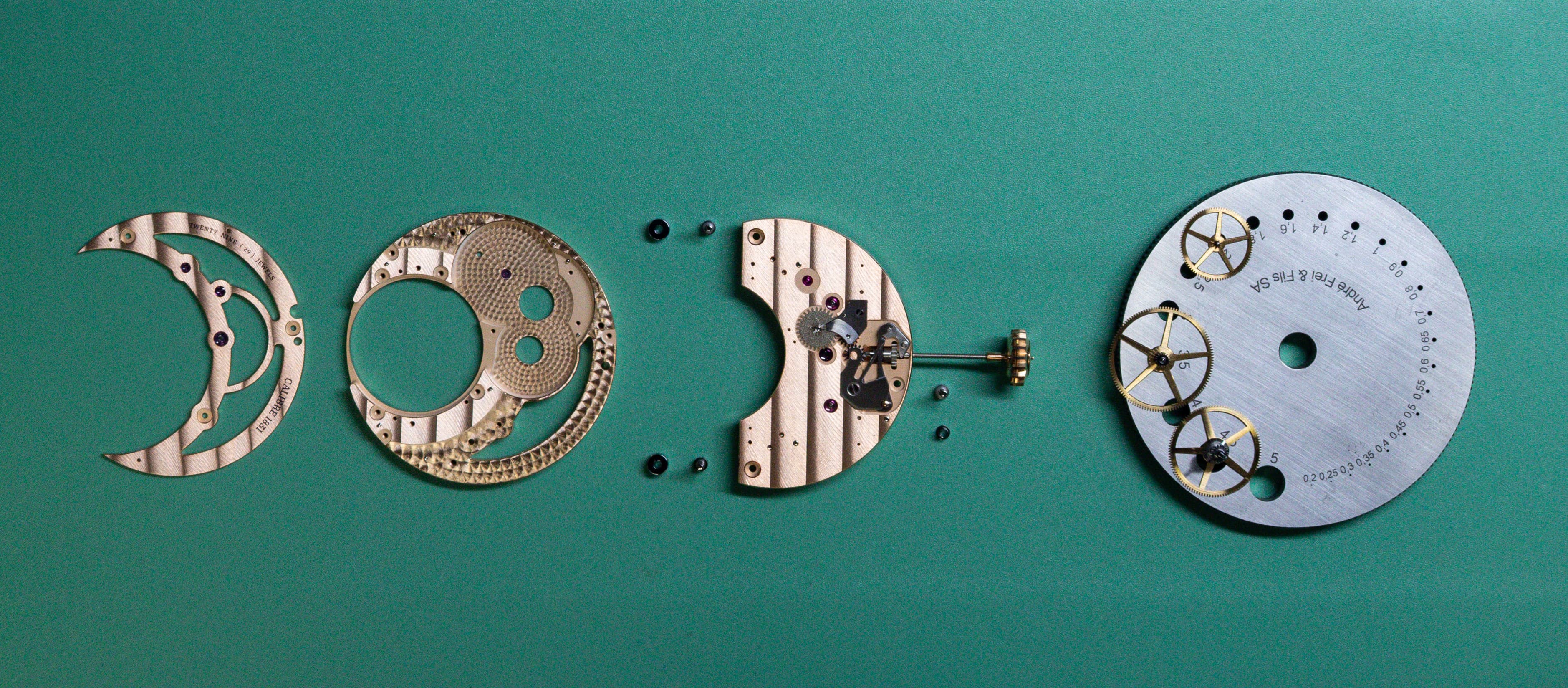 Watchmaker at the workbench with traditional tools